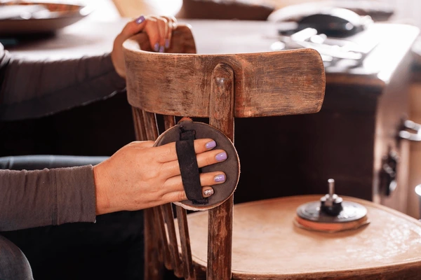 antique instrument being carefully restored by hand